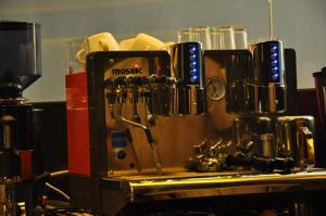 a counter with a coffee maker on a table at Tat Place Hotel in Kuala Belait