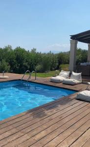 The swimming pool at or close to Georges Villa Galaxidi, family, pool and garden