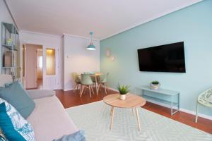 A television and/or entertainment centre at Abba Comillas Apartments