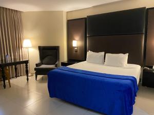 Llit o llits en una habitació de Ramada by Wyndham Princess Santo Domingo