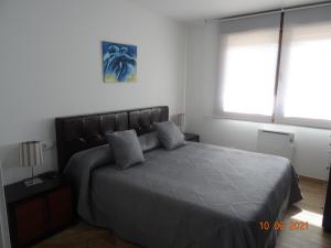 Cama ou camas em um quarto em Apartamentos Casa Manolo