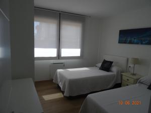 Cama ou camas em um quarto em Apartamentos Casa Manolo