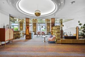 A seating area at becozy Au Parc Retro Edition Self-Check-In Rooms & Studios Fribourg