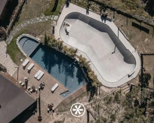 an overhead view of a swimming pool with a skateboard ramp at Bukubaki Eco Surf in Ferrel