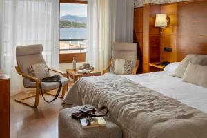 Giường trong phòng chung tại Hotel Spa Porto Cristo