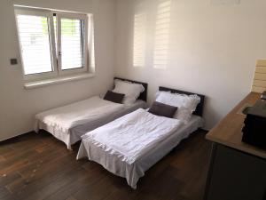 เตียงในห้องที่ Apartmány RŮŽIČKA