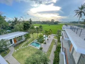 an aerial view of a house with a swimming pool at The Valerian Villa Ubud in Ubud