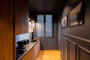 a kitchen with a sink and a counter top at Joro Living in Paris