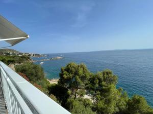 a view of the ocean from a balcony at OverTheSea - PUEBLECITO Apartment in Roses