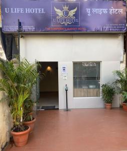 a building with a sign that reads u line hotel at U LIFE HOTEL in Mumbai