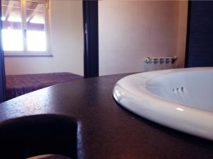 a bathroom with a white sink on a counter at La Vallata B&B in Sardegna in Ghilarza