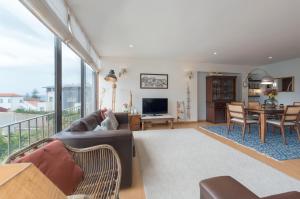 a living room with a couch and a table at Between River and Sea Porto Apartment in Porto