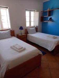 A bed or beds in a room at T2,Casa Sol e Mar 50464/AL