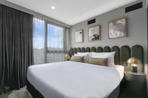 Katil atau katil-katil dalam bilik di Melbourne City Apartment Hotel