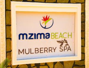 un cartello per un centro benessere di mzma beach gelberry di Mzima Beach Residences - Diani Beach a Diani Beach