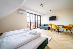 Ліжко або ліжка в номері Apartamenty Mazurskie