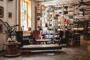 a store with chairs and tables in a room at Superbude Hamburg St Pauli in Hamburg