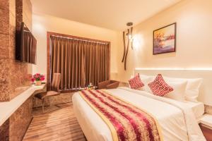 Una cama o camas en una habitación de Hotel Park Elanza Coimbatore