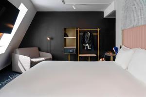 Giường trong phòng chung tại ibis Styles Paris Porte de Versailles - Mairie d'Issy