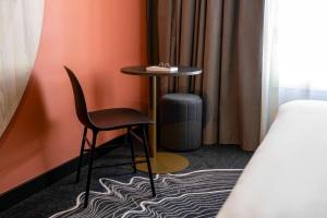 Giường trong phòng chung tại ibis Styles Paris Porte de Versailles - Mairie d'Issy