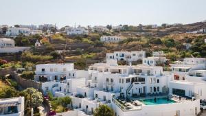 an aerial view of a city with white buildings at Rochari Hotel in Mýkonos City