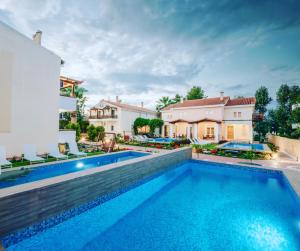 a swimming pool in the backyard of a house at Corinthian Village in Vrahati