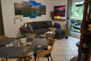 a living room with a couch and a table at Window on the mountains in Breuil-Cervinia