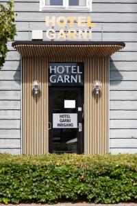 Un certificat, premiu, logo sau alt document afișat la Hotel Garni