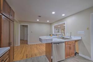 a kitchen with a sink and a large mirror at Coastal Edgewater Home with Private Hot Tub! in Annapolis