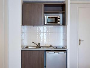 A cozinha ou cozinha compacta de Aparthotel Adagio Access Poitiers