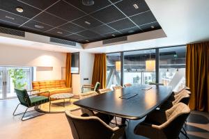 a conference room with a table and chairs at Best Western M-Treize Paris Asnieres in Asnières-sur-Seine