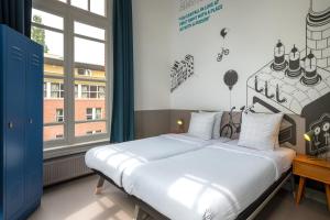 Кровать или кровати в номере Stayokay Hostel Amsterdam Vondelpark