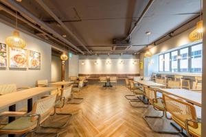 a dining room with wooden tables and chairs at Hotel Foret The Spa in Busan