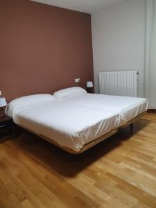 Posteľ alebo postele v izbe v ubytovaní Hostal Rural 18 de Abril