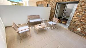 Гостиная зона в Charming Two-Bedroom Apartment in Zambujeira do Mar by Golden Zenith