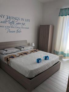 Кровать или кровати в номере B&B Isola Mia