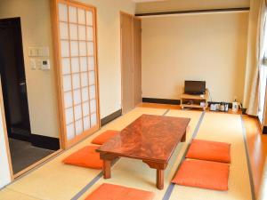 Televizorius ir (arba) pramogų centras apgyvendinimo įstaigoje Amenity Hotel Kyoto