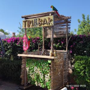 a bird sitting on top of a bird house at Nora Guesthouse Rooms and Villas in Pula