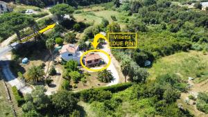 an aerial view of a house with a yellow sign at Villetta I Due Pini - ArgonautiVacanze in Capoliveri