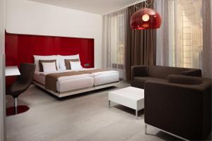 OREA Hotel Arigone Olomouc में एक कमरे में एक या कई बेड