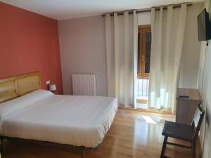 Posteľ alebo postele v izbe v ubytovaní Hostal Rural 18 de Abril