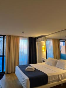 A bed or beds in a room at The best beach aparthotel Orbi city Batumi