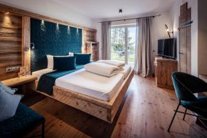 Ένα ή περισσότερα κρεβάτια σε δωμάτιο στο Boutiquehotel Blaue Burg Falkenstein