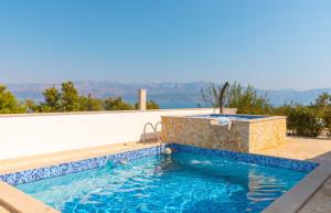 a swimming pool in a villa with a view at Villa Anabella in Supetar