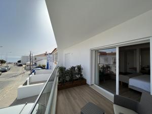 Un balcón o terraza en Alojamento White Rose Boutique