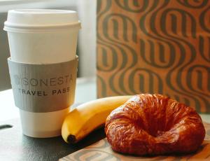 a croissant and a banana and a cup of coffee at Sonesta ES Suites Chicago - Schaumburg in Schaumburg