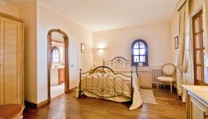 a bedroom with a bed in a room at Tenuta Cusmano in Grottaferrata