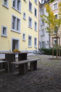 a picnic table in front of a building at INSIDE Five in Zürich