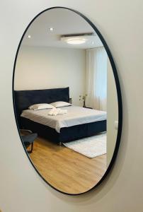 Una cama o camas en una habitación de S&A apartamentai