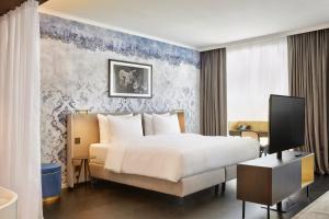 Voodi või voodid majutusasutuse HYPERION Hotel Salzburg toas